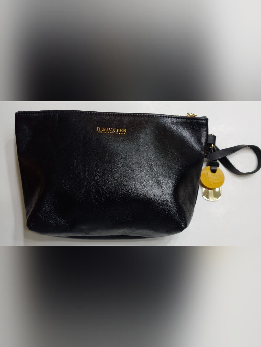 R. Riveter- Leather Clutch.